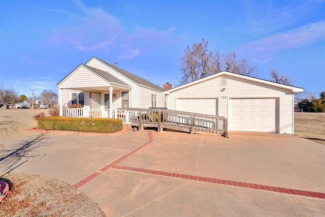 view of front of home with a garage and covered porch