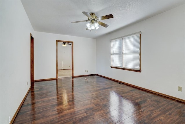 unfurnished room featuring ceiling fan, dark hardwood / wood-style floors, and a textured ceiling