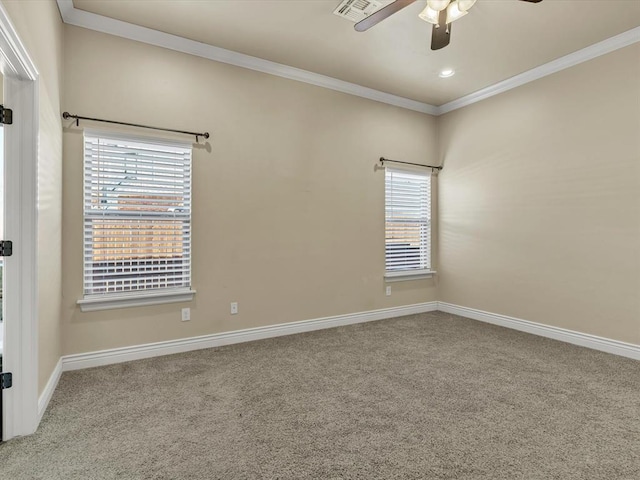 carpeted empty room with ceiling fan, recessed lighting, visible vents, baseboards, and crown molding