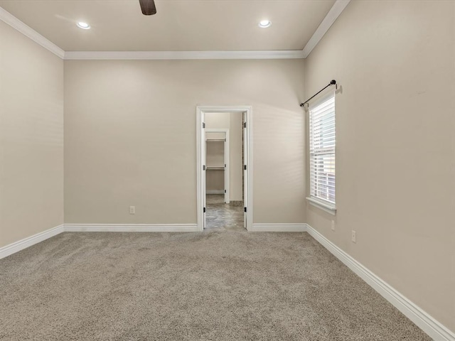 carpeted empty room featuring baseboards, recessed lighting, and crown molding