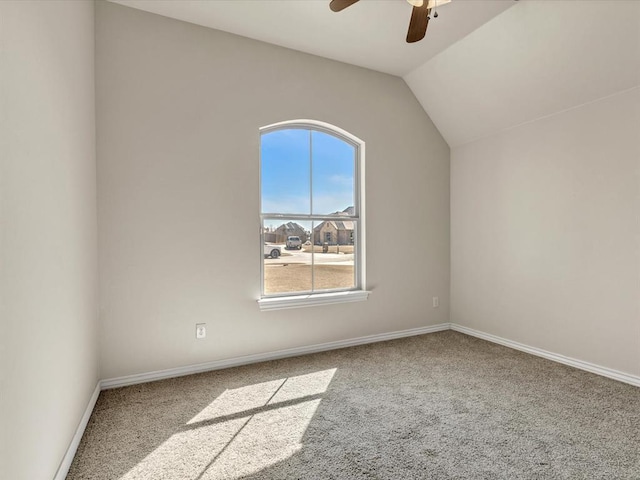 additional living space with lofted ceiling, carpet flooring, a ceiling fan, and baseboards