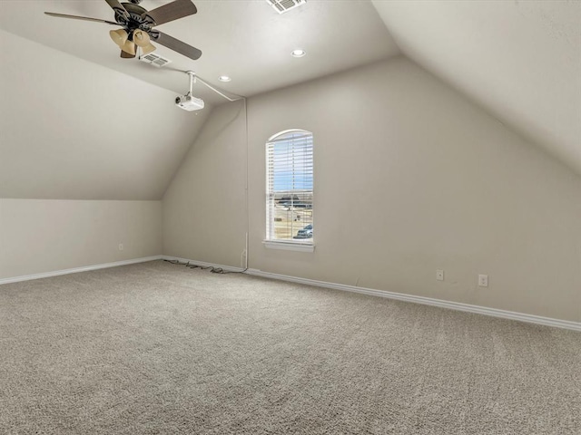 additional living space featuring lofted ceiling, recessed lighting, visible vents, baseboards, and carpet