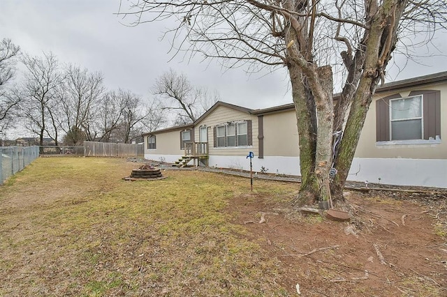 view of side of property with a yard