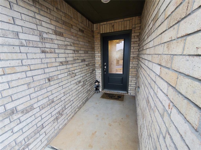 entrance to property with brick siding