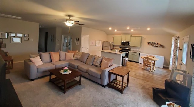 living area featuring recessed lighting, ceiling fan, light wood-style flooring, and baseboards