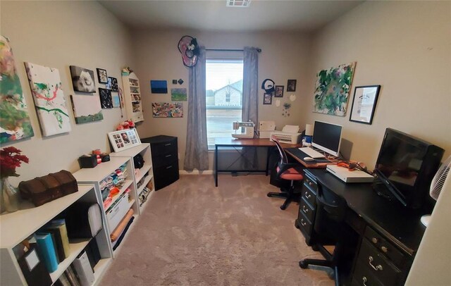 office area with light carpet and visible vents