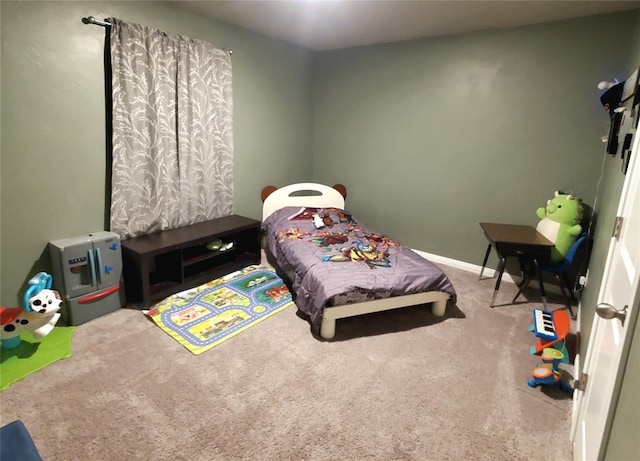 bedroom with carpet flooring and baseboards