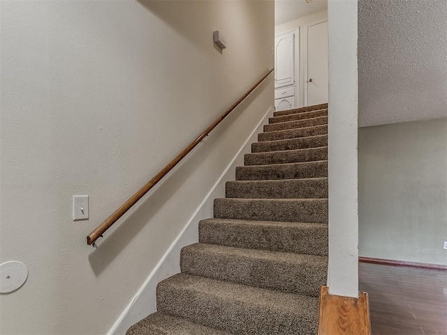 stairs with hardwood / wood-style floors