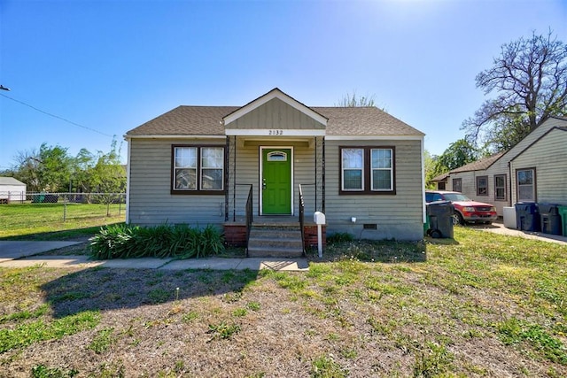 bungalow-style house featuring a front yard