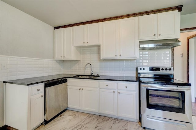 kitchen with extractor fan, appliances with stainless steel finishes, sink, white cabinets, and dark stone counters