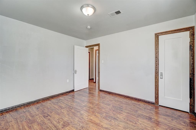 empty room featuring hardwood / wood-style floors