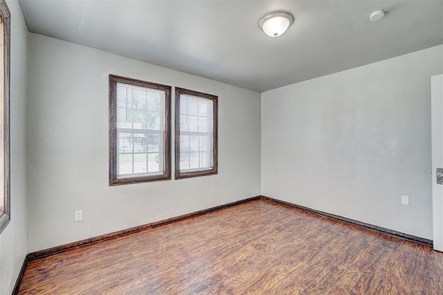 empty room featuring hardwood / wood-style floors