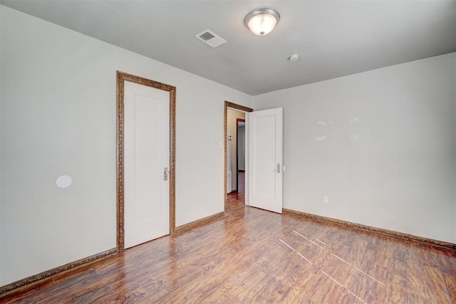 unfurnished bedroom featuring hardwood / wood-style floors