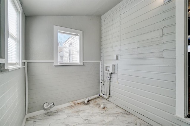 bathroom featuring lofted ceiling