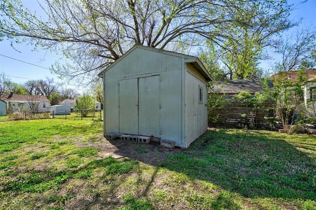 view of outdoor structure with a yard