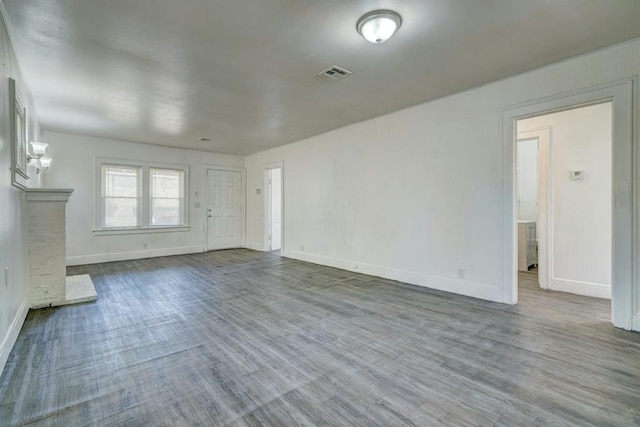 unfurnished living room with wood-type flooring