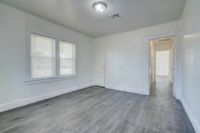 unfurnished room featuring wood-type flooring