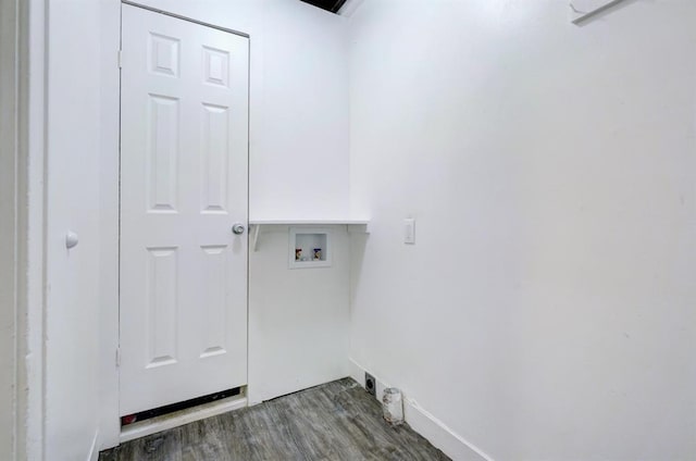 washroom with dark hardwood / wood-style floors and washer hookup