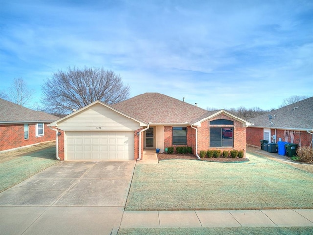 ranch-style home with a garage and a front yard