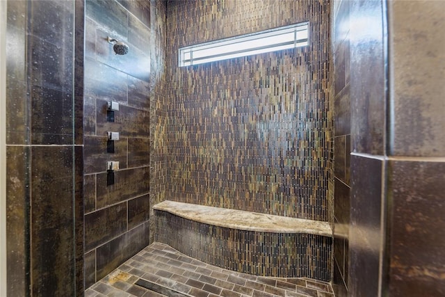 bathroom with tiled shower