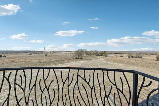 balcony featuring a rural view