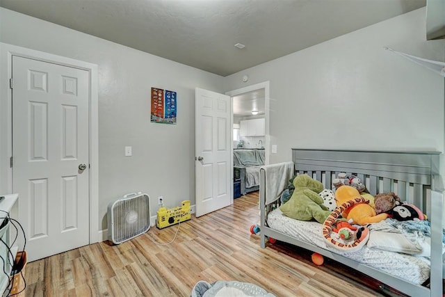 bedroom featuring light wood-type flooring