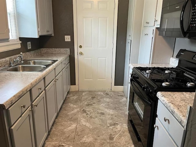 kitchen with sink and black appliances