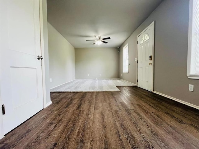 foyer entrance with dark hardwood / wood-style floors and ceiling fan