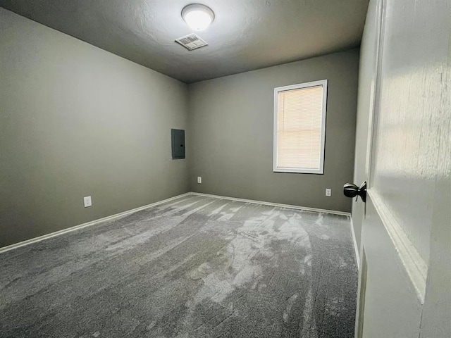 unfurnished room featuring carpet flooring and electric panel