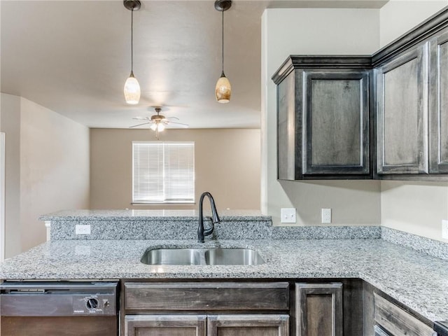 kitchen with sink, dishwasher, ceiling fan, hanging light fixtures, and dark brown cabinetry