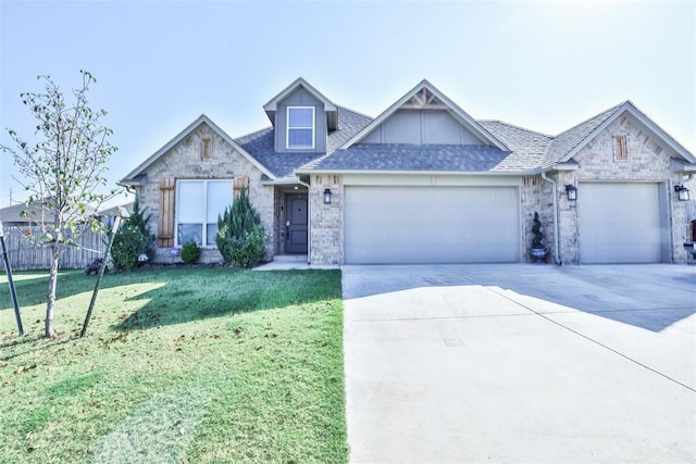 view of front of house featuring a garage and a front lawn