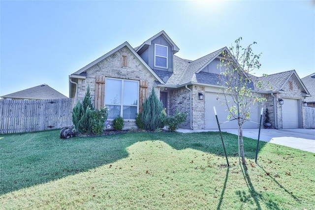 view of front of house with a garage and a front lawn