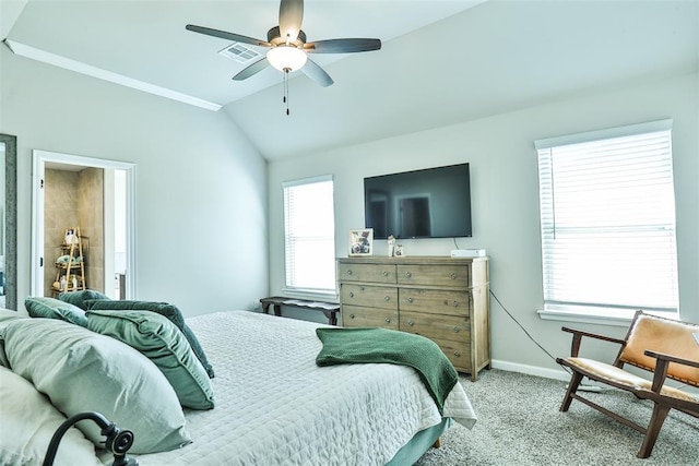 carpeted bedroom with ceiling fan and vaulted ceiling