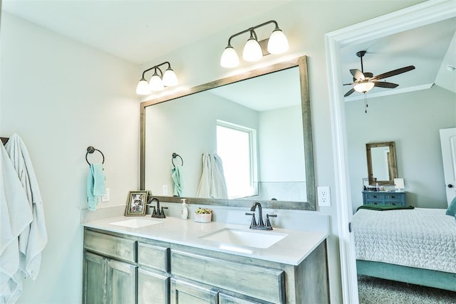 bathroom featuring ceiling fan, vanity, and vaulted ceiling