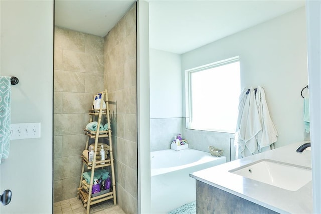 bathroom featuring vanity and a bathing tub