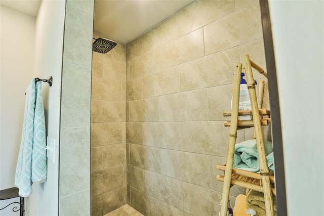 bathroom with a tile shower