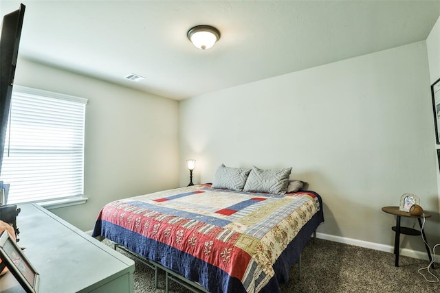 bedroom with dark carpet