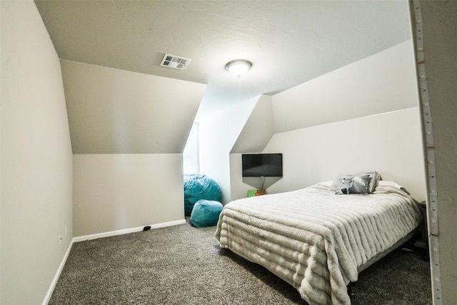 carpeted bedroom with lofted ceiling