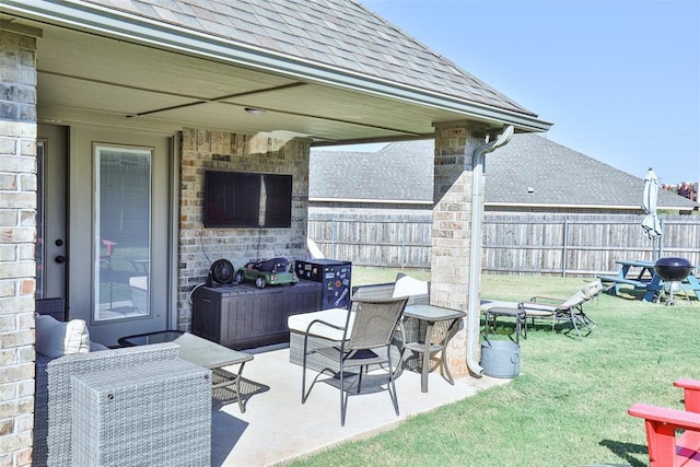 view of patio with a fireplace