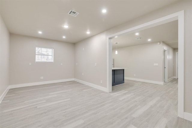 unfurnished living room with light wood-type flooring