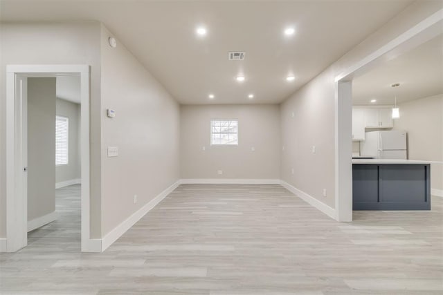 unfurnished room featuring light hardwood / wood-style flooring