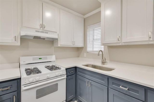 kitchen featuring white gas range, sink, gray cabinetry, white cabinets, and ornamental molding