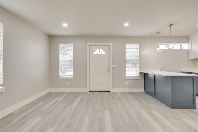 foyer entrance featuring light wood-type flooring