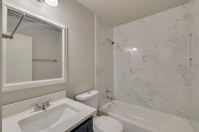 full bathroom featuring vanity, toilet, and tiled shower / bath combo