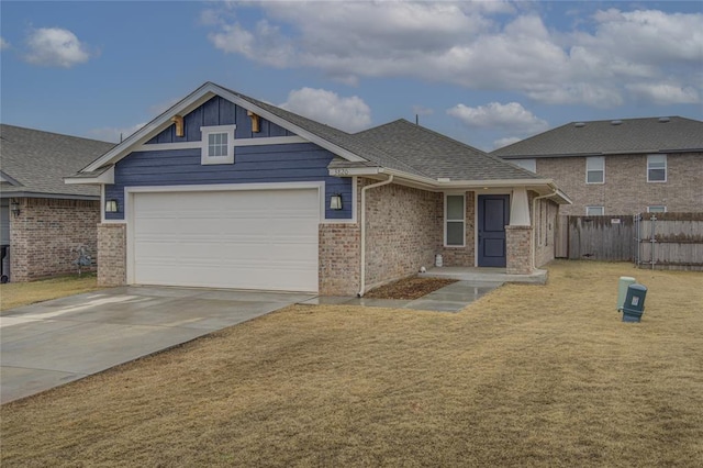 view of front facade with a garage and a front yard