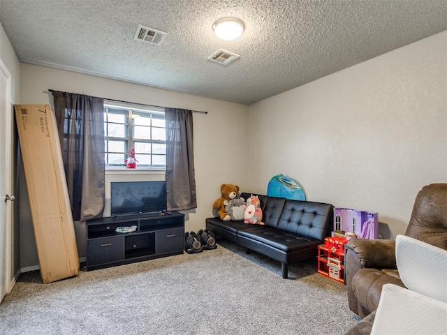 living room with a textured ceiling and carpet flooring