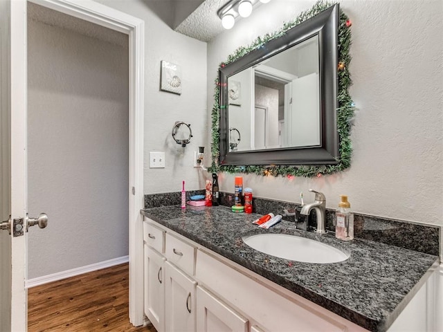 bathroom featuring wood-type flooring and vanity