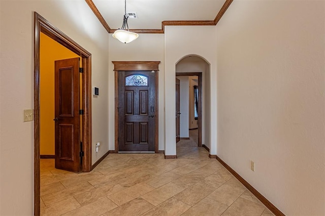 foyer entrance featuring ornamental molding