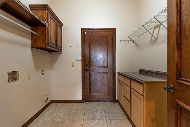 laundry area featuring cabinets, washer hookup, and hookup for an electric dryer