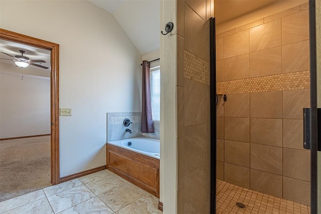 bathroom featuring ceiling fan, plus walk in shower, and vaulted ceiling